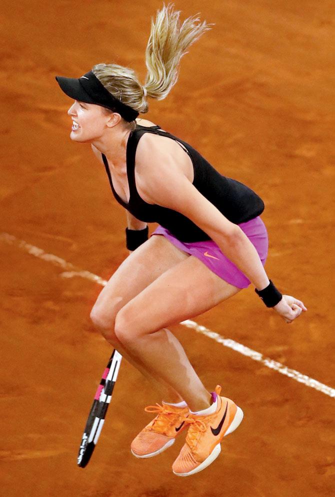 Eugenie Bouchard is ecstatic after beating Maria Sharapova 7-5, 2-6, 6-4 in the Madrid Open second round on Monday. Pics/Getty Images