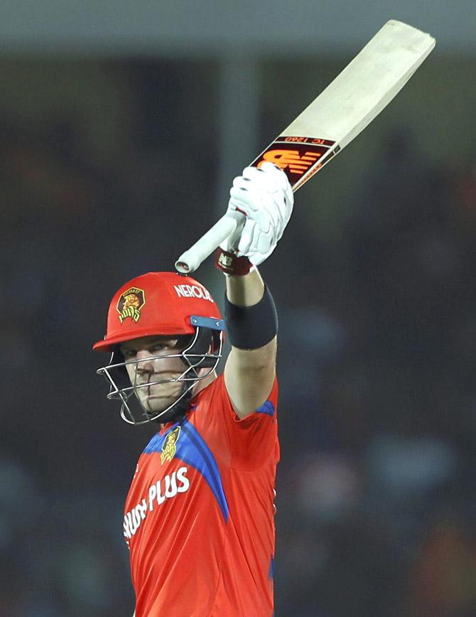 Aaron Finch of the Gujarat Lions raises his bat after scoring 50 runs during an IPL match against Delhi Daredevils. Pic/PTI