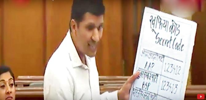 MLA Saurabh Bhardwaj demonstrates the tampering of an EVM in the Delhi assembly yesterday