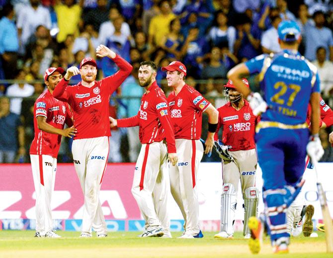 Kings XI Punjab players celebrate the dismissal Mumbai Indians’ Lendl Simmons in an IPL-10 match at Wankhede yesterday. Pic/AFP