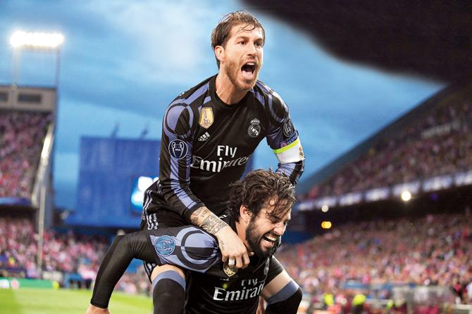 Real Madrid captain Sergio Ramos (top) celebrates Isco