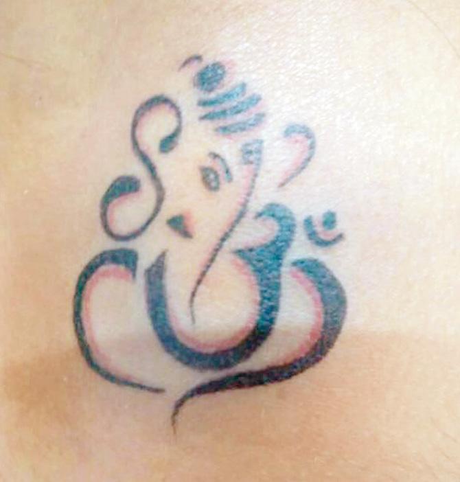 The Ganesh and Om tattoo she had got on her shoulder