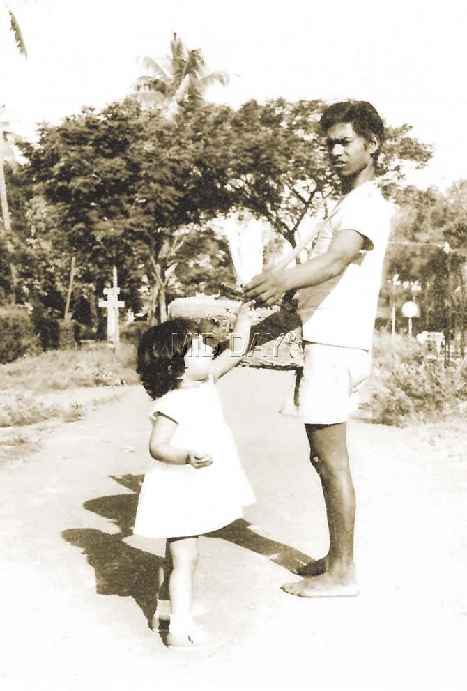 A chana walla at Shivaji Park with one of his youngest customers, a little  over a year old Anuradha Chaubal in 1960