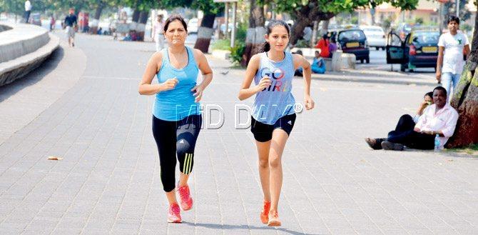 Rashmi Harlalka, a Marine Drive resident runs with her daughter, Sia. PIC/Milind Saukar