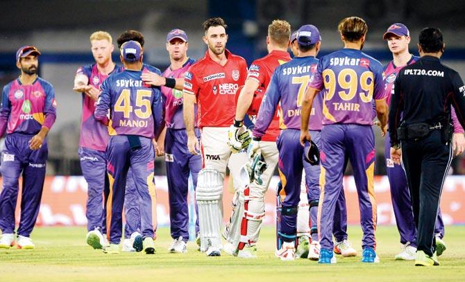 KXIP players shake hands with RPS team members after their six-wicket win in Indore last month. Pic/AFP