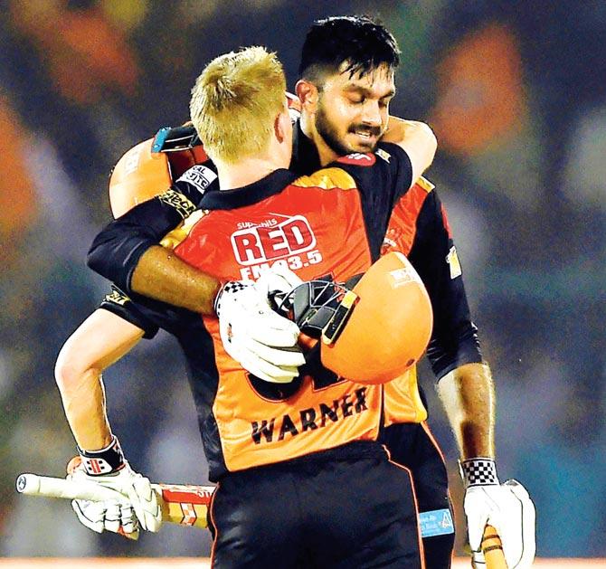 Skipper David Warner celebrates Hyderabad’s win over Gujarat with Vijay Shankar on Saturday. Pic/AFP