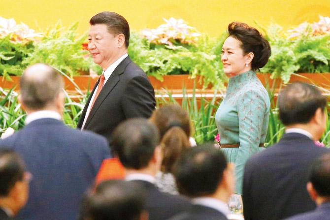 Chinese President Xi Jinping and wife Peng Liyuan arrive for a welcome banquet for the Belt and Road Forum at the Great Hall of the People in Beijing on Sunday. Pic/AFP