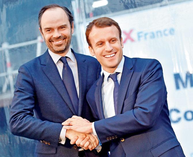 File photo of Emmanuel Macron with Edouard Philippe. Pics/AFP