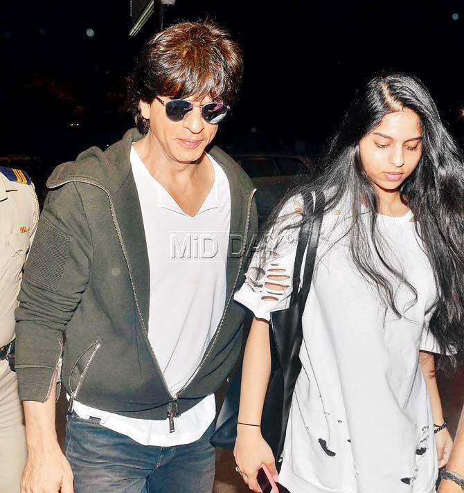 SRK and Gauri Khan colour coordinate tees with daughter Suhana