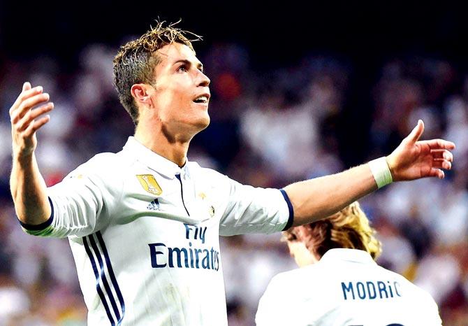 Real Madrid forward Cristiano Ronaldo celebrates his goal against Sevilla during a La Liga match at Madrid on Sunday. Real Madrid won 4-1. Pic/AFP