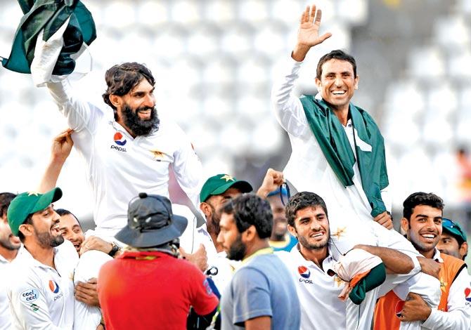 Retiring Pakistan cricketers Misbah-ul-Haq (left) and Younis Khan are carried by teammates as they celebrate their 2-1 Test series win over West Indies in Roseau, Dominica on Sunday. Pic/AFP