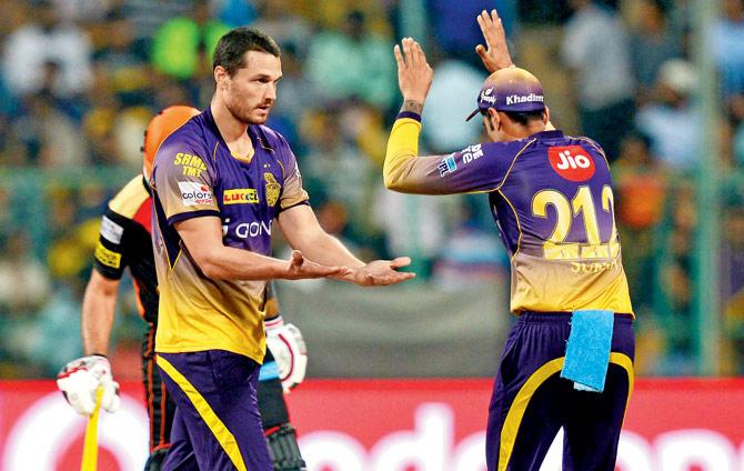 KKR players celebrate the fall of a Sunrisers Hyderabad wicket at  M Chinnaswamy Stadium in Bangalore yesterday. Pic/AFP