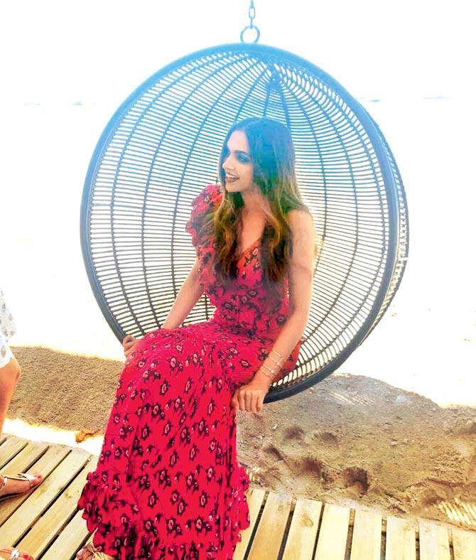 Deepika chilled by the beach in a red maxi dress by Johanna Ortiz