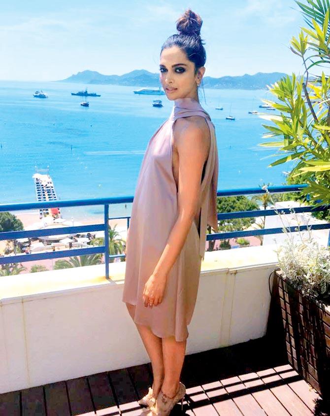 Deepika Padukone chose a satin ensemble from Galvan London with beige Christian Louboutin heels and statement jewellery for a photo call at the French Riviera yesterday