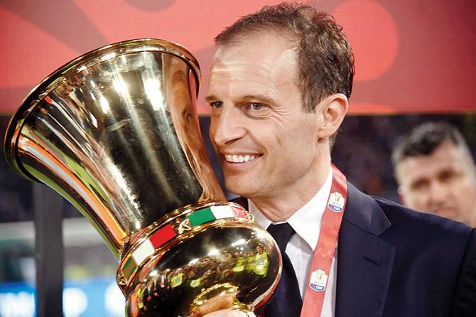 Juve boss Allegri with the Italian Cup on Wednesday. Pic/AFP