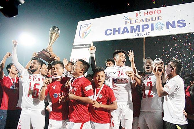 Aizawl FC players celebrate with the I-League trophy after winning the match vs Shillong Lajong at Shillong yesterday. Pics/AIFF