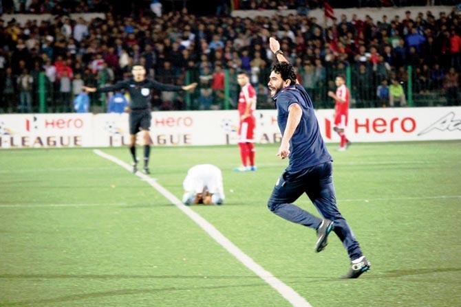 Aizawl FC head coach Khalid Jamil ecstatic after the final whistle was blown yesterday