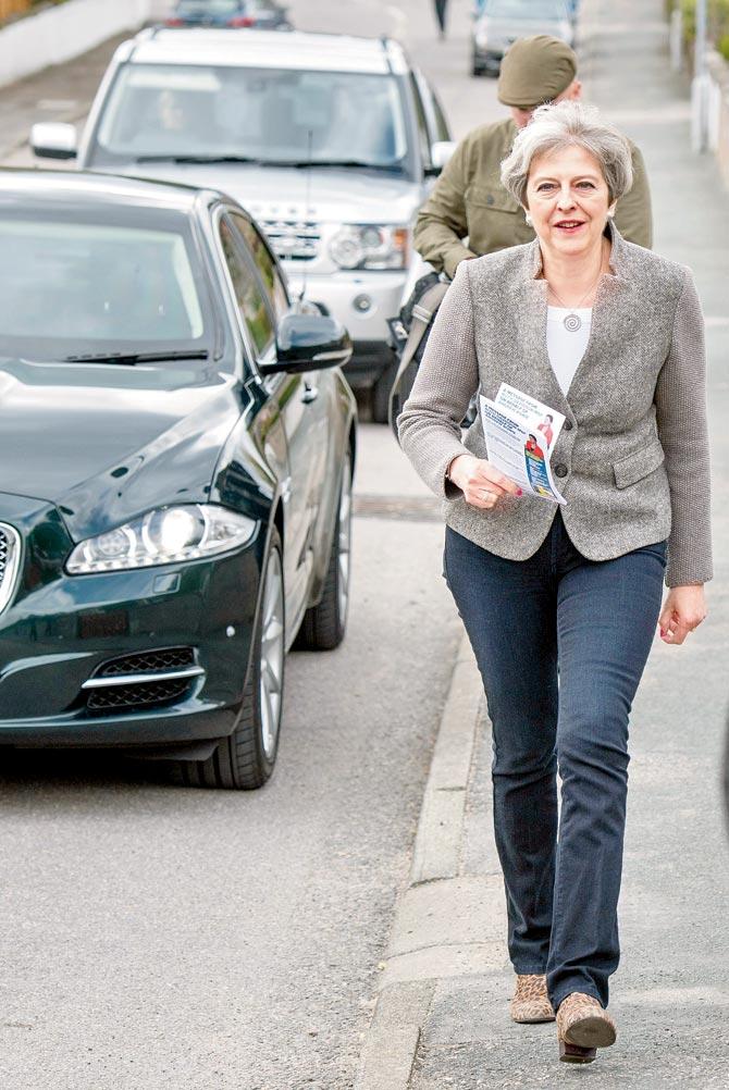 Britain’s Prime Minister Theresa May goes door-to-door campaigning. Pic/AFP