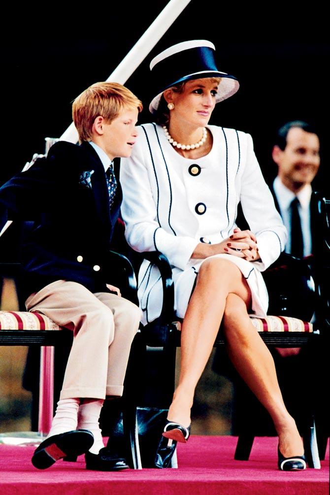 Princess Diana and her son Harry watch the march past on a dais as part of the commemorations of VJ Day on August 19, 1995
