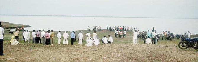 Locals gather at the spot where the Solapur doctors drowned near the Ujani dam