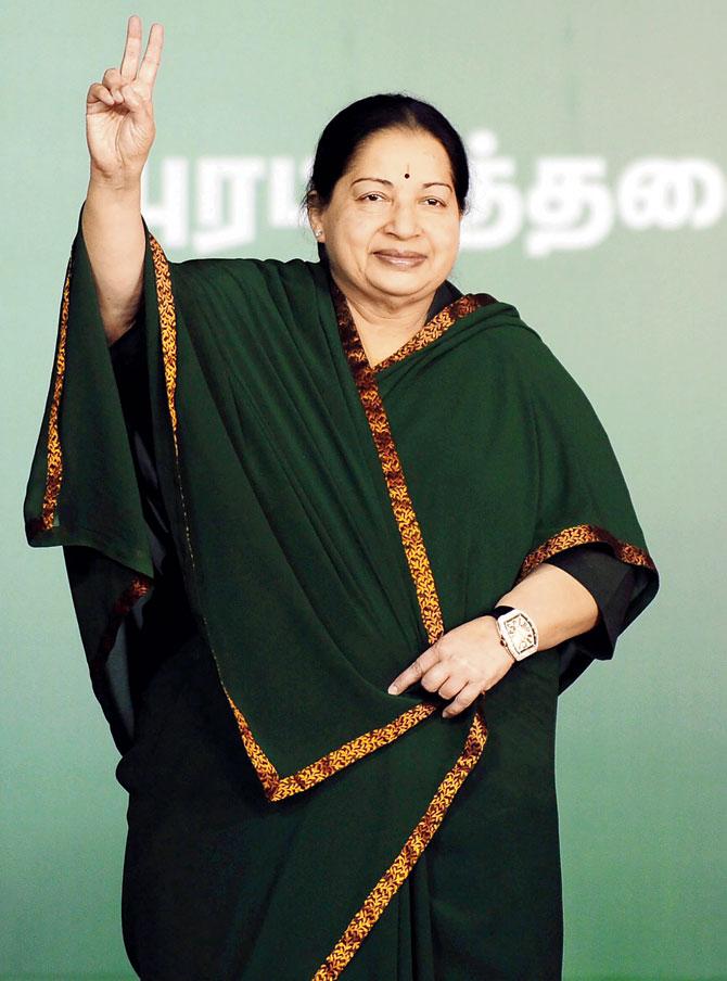 Jayalalitha flashes her famous victory sign. Pic/AFP