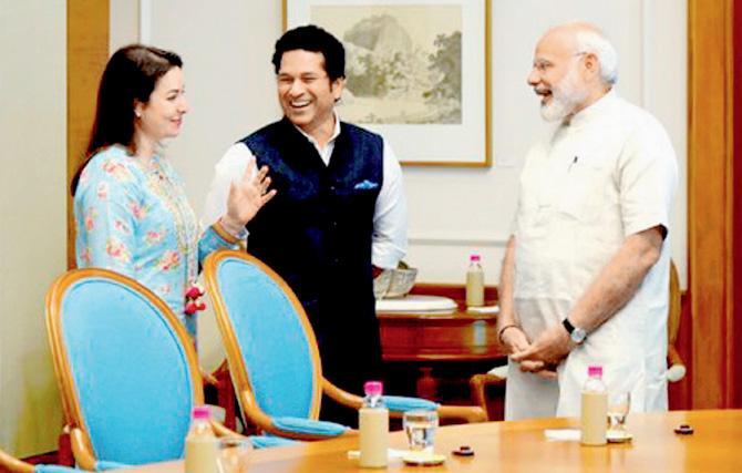 Prime Minister Narendra Modi (right) chats with cricket legend Sachin Tendulkar and his wife Anjali in New Delhi yesterday. Pic/PTI