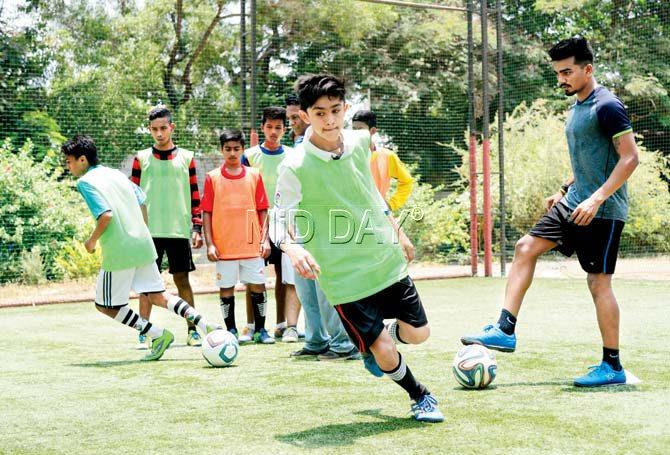 Footballer Pratik Shinde trains the children at his academy in Chembur