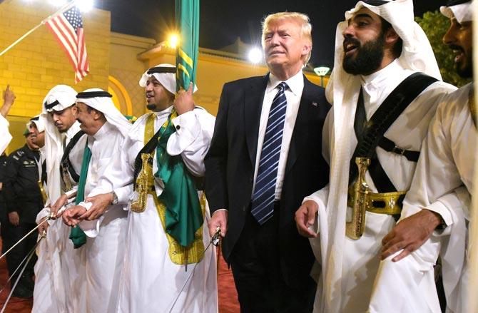 US President Donald Trump joins dancers with swords at a welcome ceremony ahead of a banquet at the Murabba Palace in Riyadh. Pic/AFP