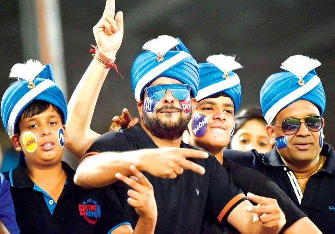 Mumbai Indians fans cheer for their team during the IPL-10 final against Rising Pune Supergiant in Hyderabad yesterday. Pic/PTI