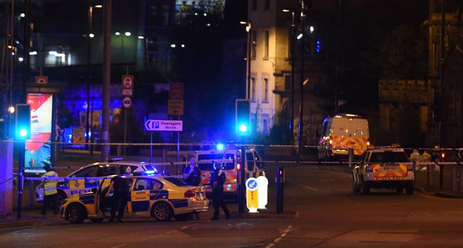 Police deploy at scene of a reported explosion during a concert in Manchester, England, on May 23, 2017. British police said early May 23 there were "a number of confirmed fatalities" after reports of at least one explosion during a pop concert by US singer Ariana Grande. Ambulances were seen rushing to the Manchester Arena venue and police added in a statement that people should avoid the area. Pic/AFP
