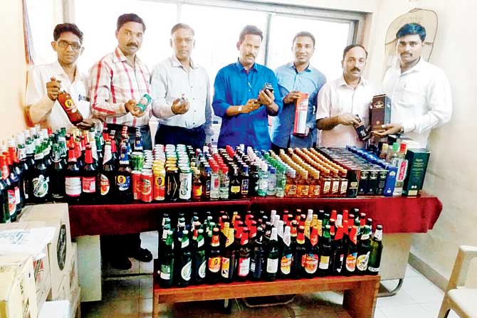The excise officers with the liquor haul from Saarthi Bar