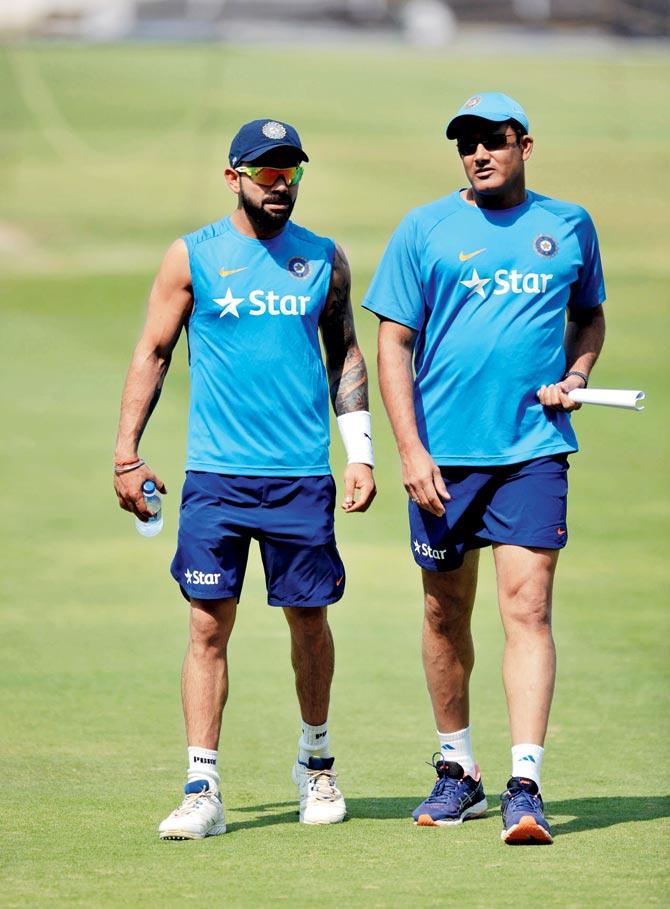 India skipper Virat Kohli (left) and head coach Anil Kumble chat after inspecting the pitch before the Test vs Bangladesh at the Rajiv Gandhi International Cricket Stadium in Hyderabad on February 7.