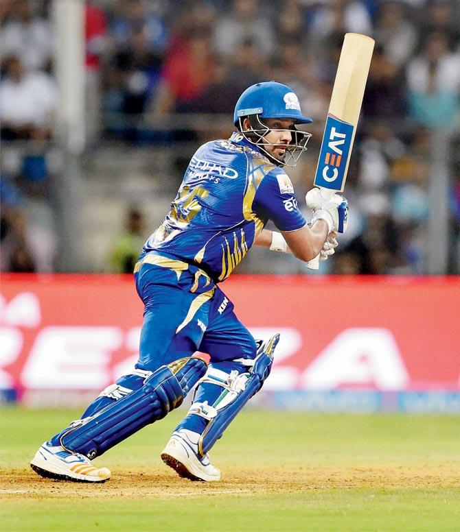 MI skipper Rohit Sharma plays a shot during the match vs RCB at the Wankhede yesterday. Pics/PTI