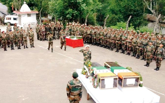 Indian Army pays its respects during a ceremony for the two soldiers, in Poonch on Tuesday. Pic/AFP