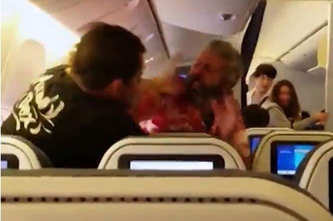 Fight on flight: Two passengers beat each other wildly as video goes viral