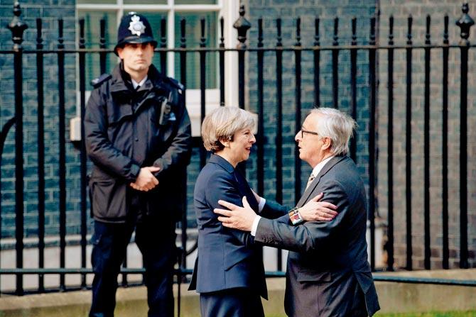 File photo shows European Commission President, Jean-Claude Juncker (right) being greeted by British Prime Minister Theresa May outside 10 Downing Street last week. Pic/AFP
