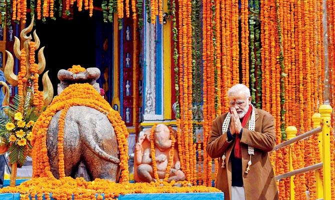 Prime Minister Narendra Modi pays obeisance at Kedarnath as the portals of the eighth century shrine in Garhwal Himalayas are thrown open to devotees after a six-month-long break. Modi is the first PM to visit the temple in 28 years, after VP Singh. Pic/AFP