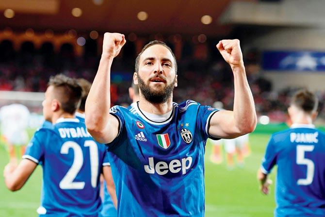 Juventus’ Gonzalo Higuain celebrates after scoring a goal against Monaco during the Champions League  first leg semi-final match at Stade Louis II Stadium on Wednesday. Juventus won 2-0. Pic/AFP
