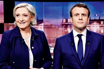Macron laments Le Pen is 'spreading lies', files complaint