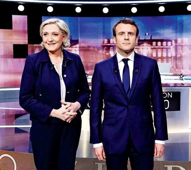 Marine Le Pen and  Emmanuel Macron prior to the debate. Pic/AFP