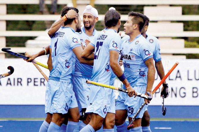 Indian players celebrate a goal against Great Britian recently