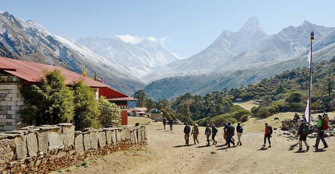 Trekkers in front of the Mt Everest range at Tengboche. Pic/AFP