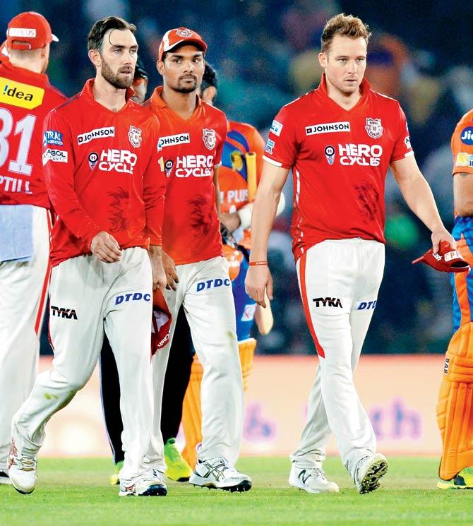 Kings XI Punjab players leave the field after their six-wicket defeat to Gujarat Lions at PCA Stadium in Mohali on Sunday. Pic/AFP