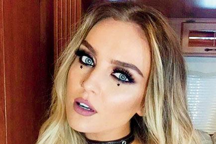 Perrie Edwards watches Arsenal match with beau Chamberlain's mom