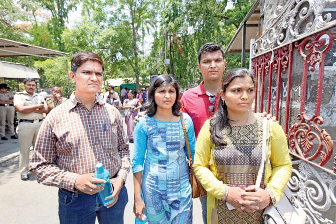 Nayana’s brother Prashant Pathak (in red) and her sisters Manisha Gambawale (in blue) and Madhuri Jadhav (in yellow) after the verdict.