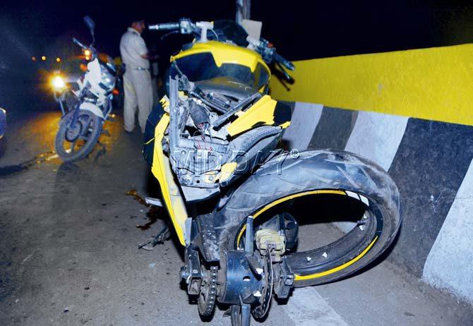 The impact of the collision flung the bike towards the bridge barrier, crushing it completely