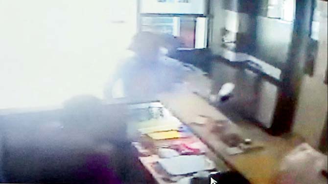 A CCTV grab, which shows the suspect waiting near the reception
