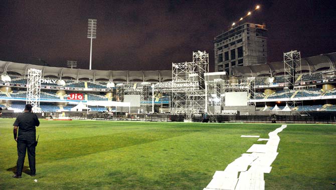 Workers are adding finishing touches to the DY Patil Stadium