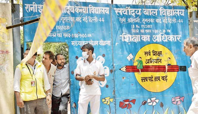 NDRF workers survey the condition around Rani Jhansi School in southeast Delhi