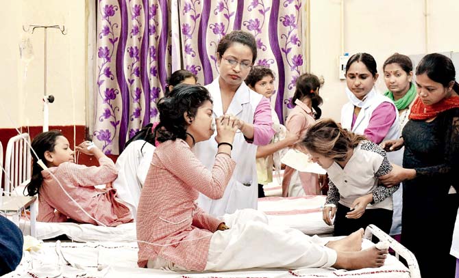 School students being treated at a hospital after the gas leak in New Delhi on Saturday. Pic/PTI